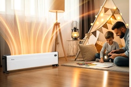 Lifestyle image of the Kraxton Baseboard Heater with a father & son playing in the background