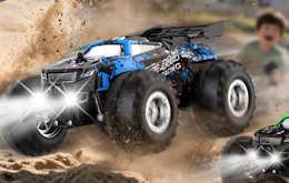 a blue remote control care in dirt 