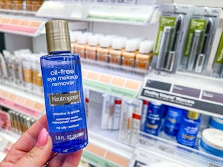 hand holding a bottle of neutrogena makeup remover at target