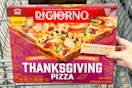 hand holding a digiorno thanksgiving pizza