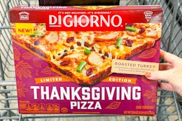 hand holding a digiorno thanksgiving pizza