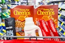 cheerios, axe body wash, arm & hammer detergent, and colgate toothpaste in a cart