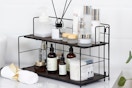 7.3"D x 16"W x 9.8"H two-tier organizer for bathroom or kitchen counter. Metal frame with wood shelves. Non-slip feet.