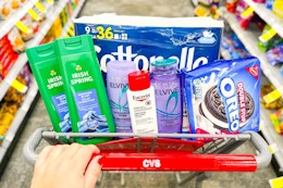 cottonelle toilet paper, irish spring body wash, loreal elvive shampoo, eucerin lotion, and oreo cookies in a cart