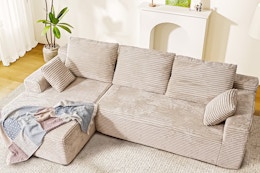 Lifestyle image of a beige cloud sofa in living room setting