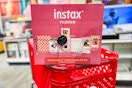 Instax Fujifil Camera Bundle Box on a Target shopping cart in the electronics area