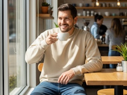 a man wearing a fruit of the loom sweatshirt