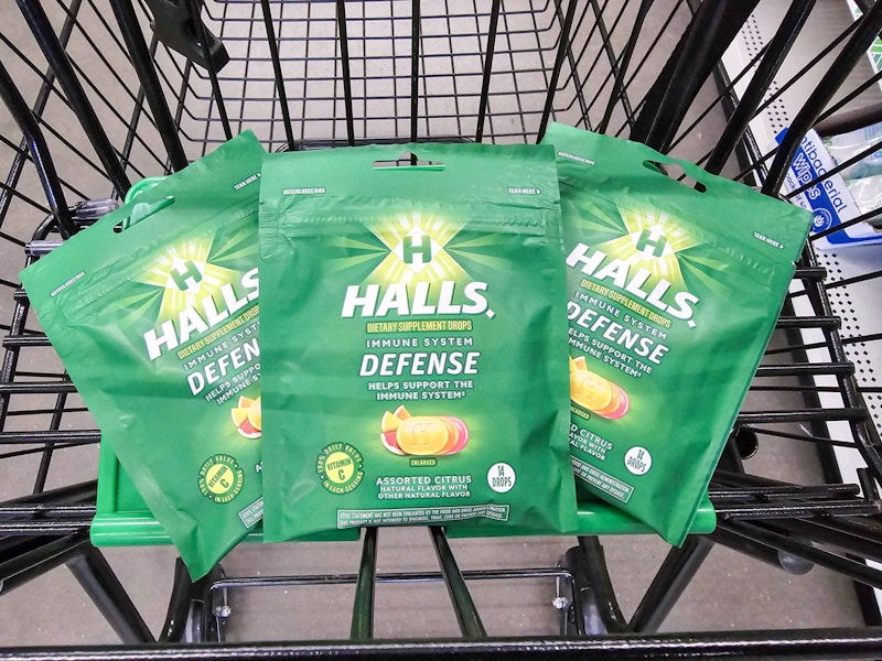 3 bags of halls cough drops in a cart