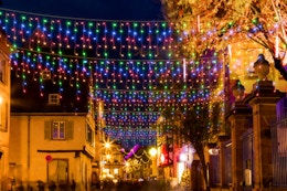 FLVOECN LED Christmas Lights hanging from store fronts.