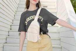 woman wearing white crossbody bag