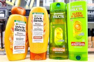 4 bottles of garnier whole blends and fructis shampoo and conditioner