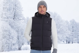Man wearing the Rrtizan Heated Vest outdoors in the snow.