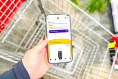 hand holding a smartphone displaying a 1-clip coupon in the kcl app