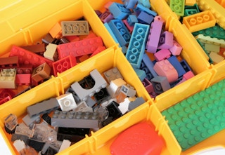 legos in a yellow suitcase container