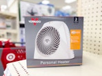 In-store image of the Vornado Personal Heater in end cap on shelf in front of Target shopping cart