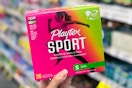 hand holding a box of playtex sport tampons
