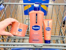 3 vaseline products sitting in a walmart cart
