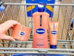 3 vaseline products sitting in a walmart cart