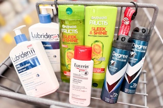 lubriderm, garnier, degree, and eucerin products in a cart