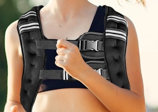 a person running with a weighted vest on