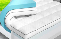 a mattress topper on a bed