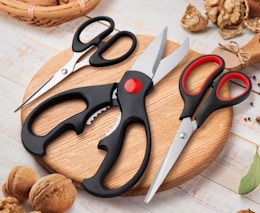 three kitchen shears on a cutting board