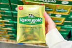 hand holding a pack of kerrygold irish butter