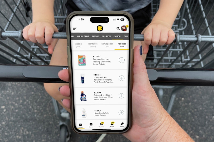 ibotta app being held in front of cart with child