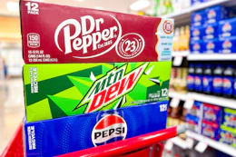 dr pepper, mtn dew, and pepsi soda 12-packs in a shopping cart