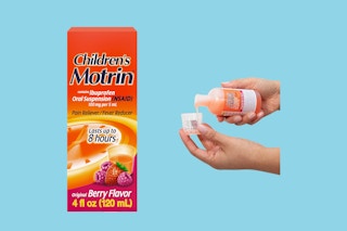 Two disembodied hands pour a dose of children's Motrin next to a box of children's Motrin.