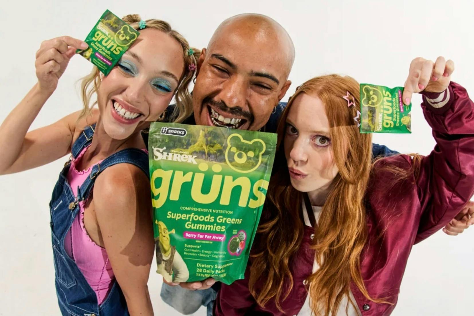 a group of people holding up gruns gummies
