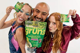 a group of people holding up gruns gummies