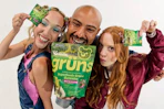 a group of people holding up gruns gummies