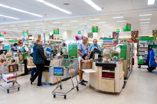 People at the checkout inside Publix