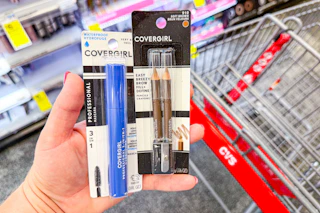 person holding covergirl mascara and eyeliner over a cvs cart