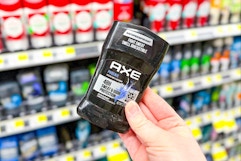 hand holding axe deodorant