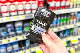 hand holding axe deodorant