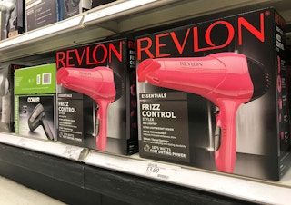 Revlon hair dryers on a store shelf.
