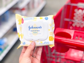 hand holding out baby wipes at Target