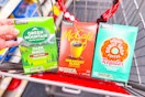 green mountain, mccafe, and donut shop coffee pods in a cart