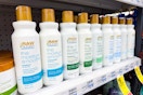 raw sugar shampoo and conditioner on a shelf