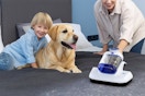 a family near a bed vacuum cleaner