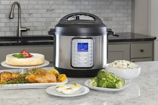  Instant Pot Duo Plus 9-in-1 Multicooker on a kitchen counter with food.