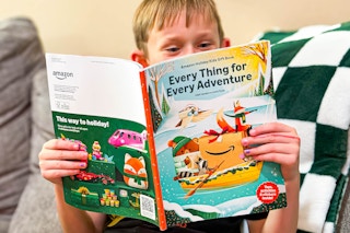 a child looking through the amazon toy book