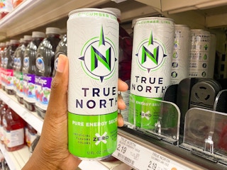 hand holding up True North can in Target aisle