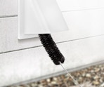 a dryer brush cleaning out a vent 