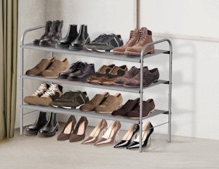 a shoe rack against the wall with shoes on it
