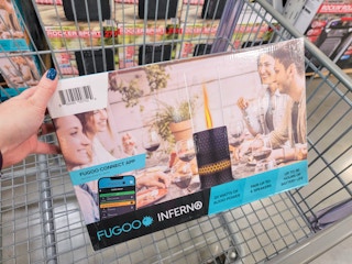 hand holding a fugoo inferno wireless speaker in a cart