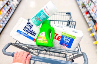 walgreens napkins, laundry detergent, toilet paper, and disinfecting wipes in a cart