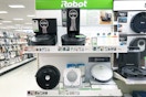 roomba vacuums sitting on a target shelf
